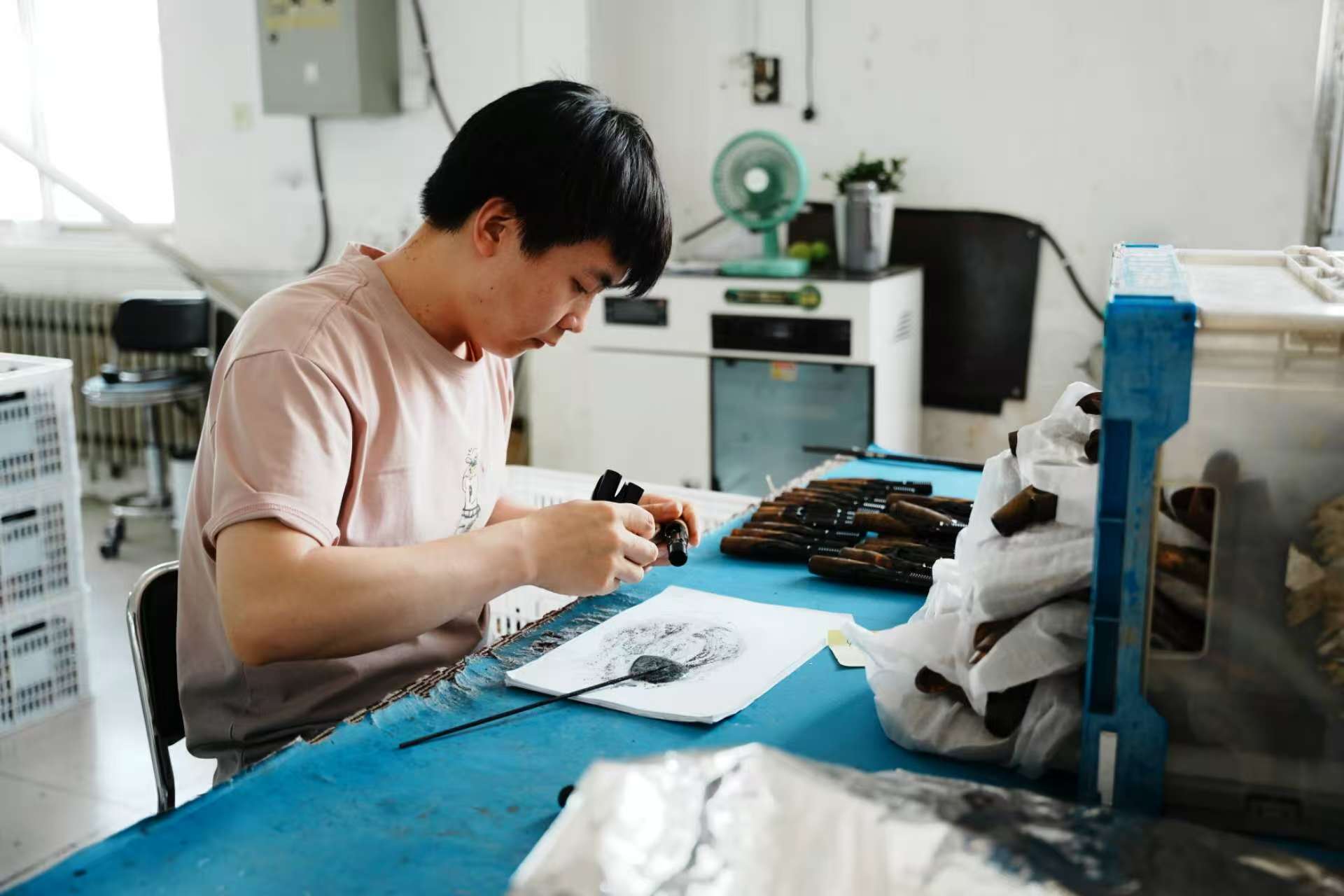 Rod handle components being fitted during production